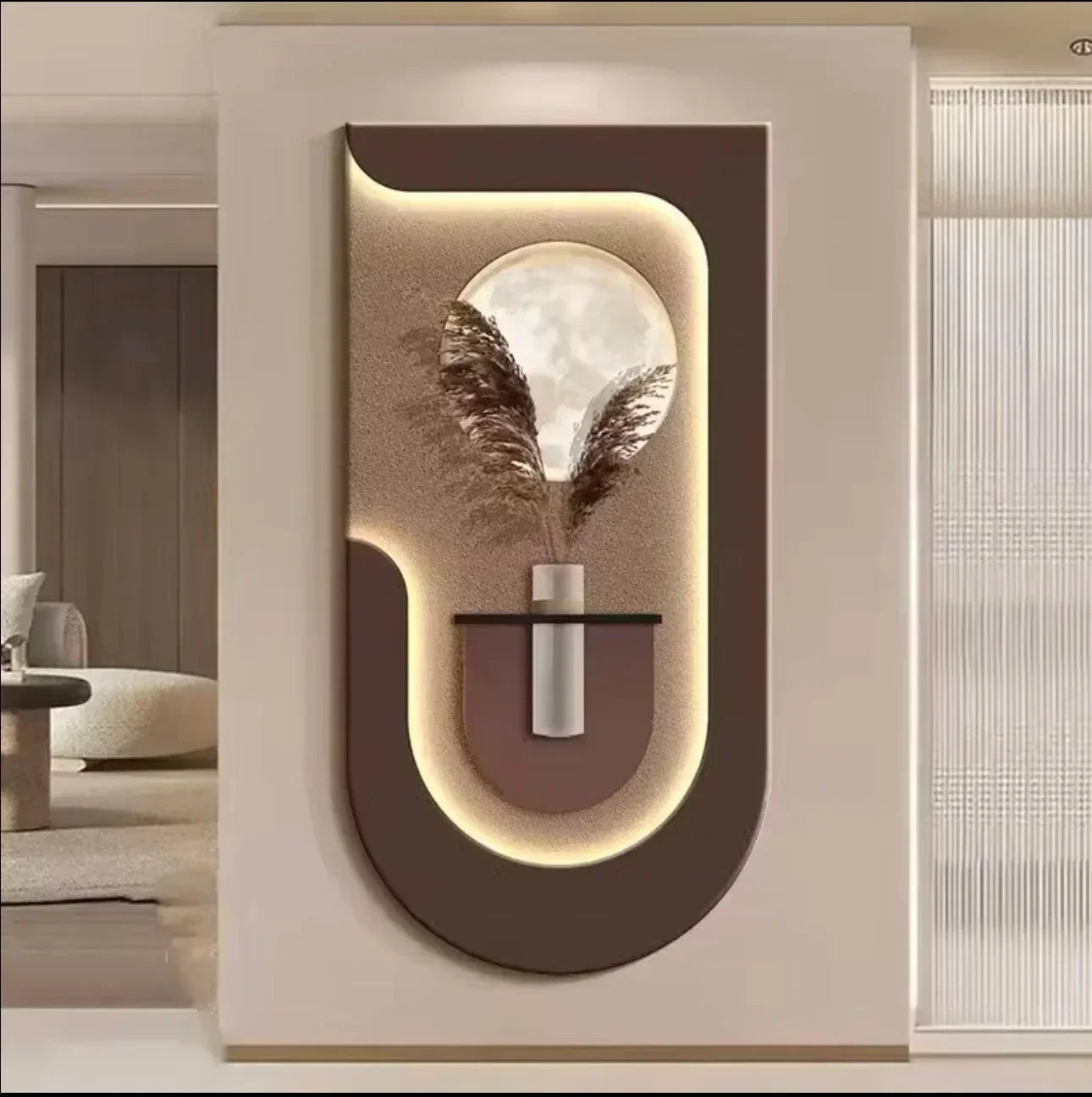 Modern wall art piece with a vase and feathers on a neutral background