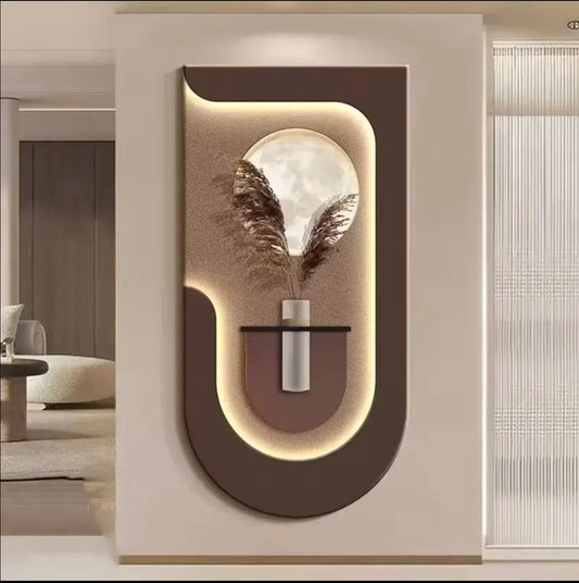 Modern wall art piece with a vase and feathers on a neutral background