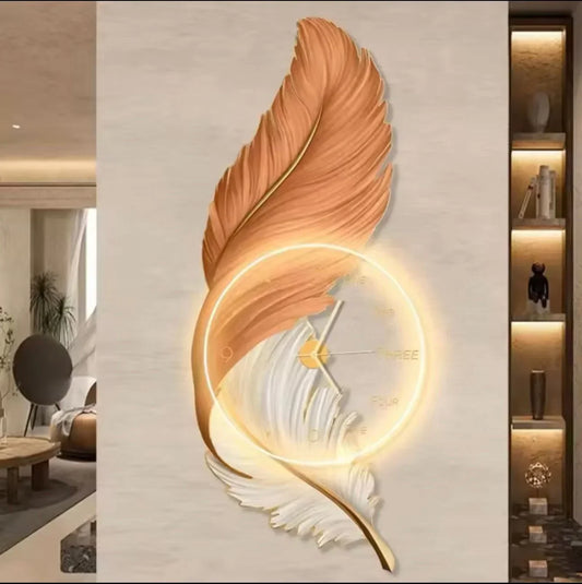 Decorative wall clock shaped like a feather with a warm glow on a neutral wall.